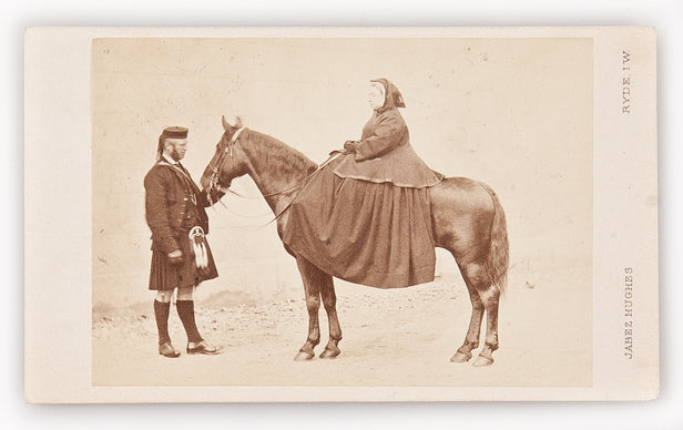Carte de Visite featuring Queen Victoria seated on her pony Flora, with her personal servant John Brown attending.