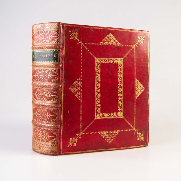 (King James Version). The Holy Bible. Contemporary red morocco, panelled in gilt. Cambridge: John Archdeacon, 1768.
