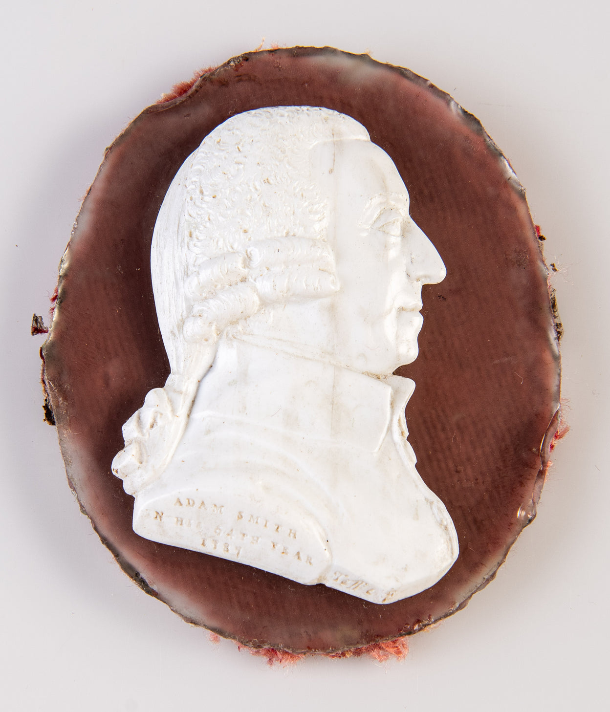 White vitreous / glass paste profile head-and-shoulders right-facing profile portrait bust of Adam Smith by James Tassie; incised inscription and signature in the truncation: 
