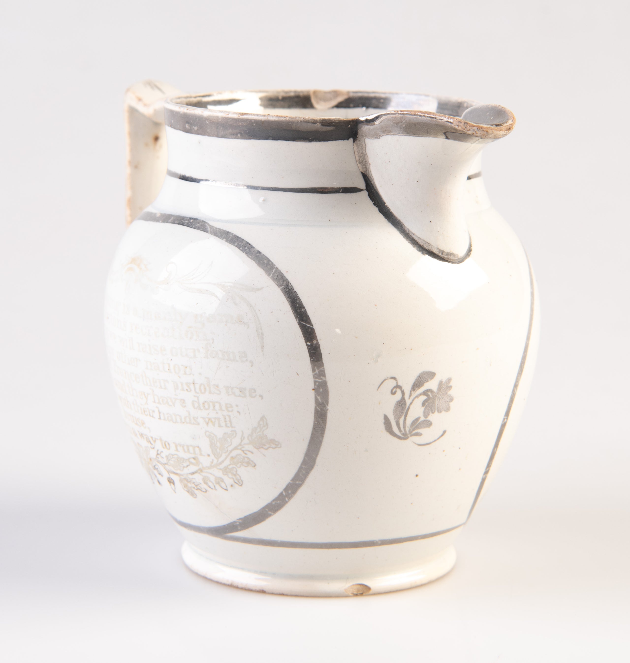 [Pearlware jug decorated with transfer image of Tom Molineux and Tom Cribb facing each other in a boxing match, a verse to the other side.]